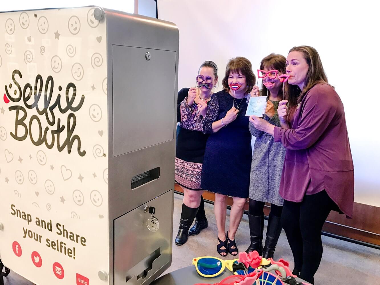 4 Girls taking selfie with Selfie Booth