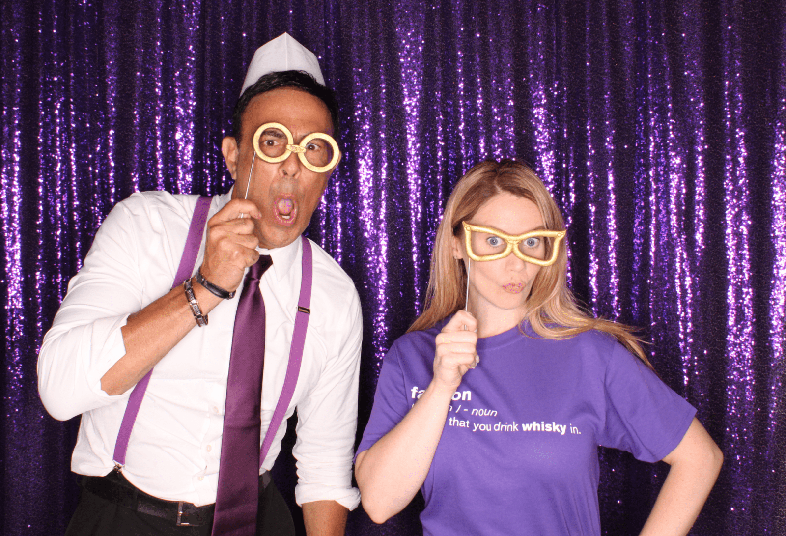 A Couple Taking Picture and Using Props