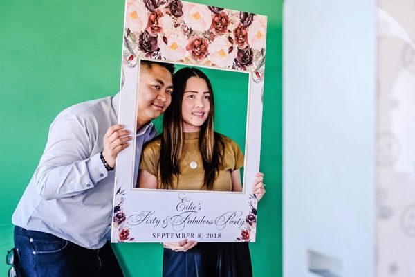 Couple Taking Selfie With Photobooth